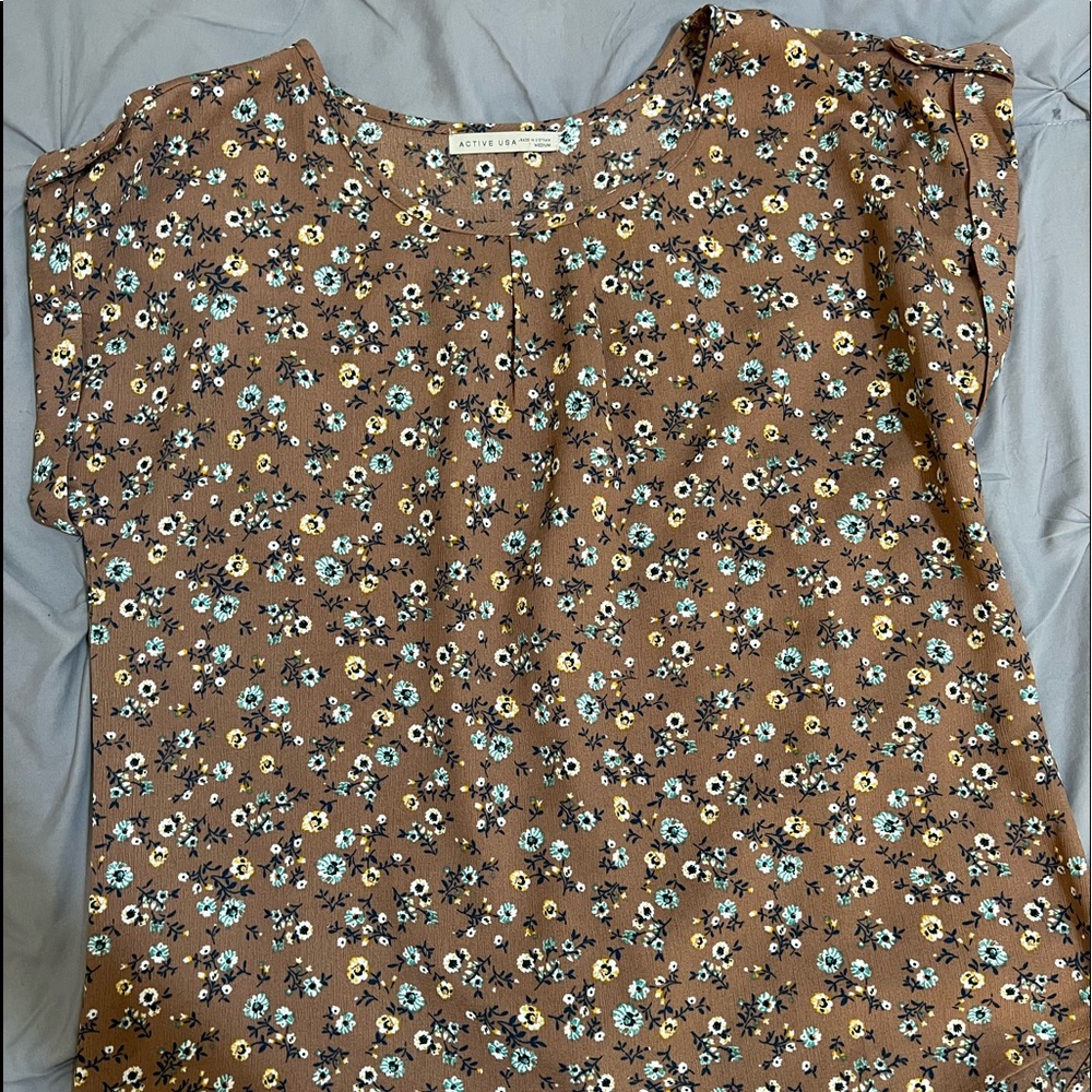 Brown floral top in size M